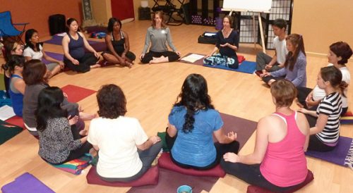 sitting in meditation in a group circle
