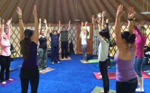 Yoga in a circle - Our arms above our heads
