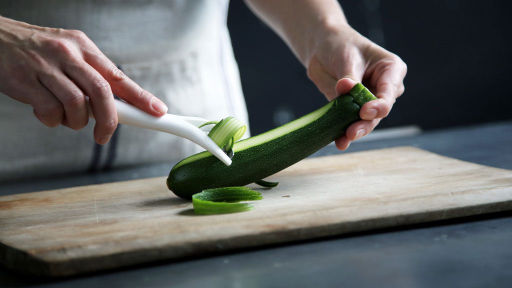Peeling a cucumber