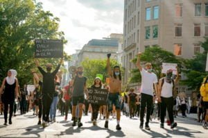 peaceful protesters walking down a street