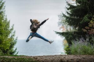 woman jumping in the air with joy