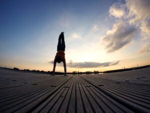 Handstand on a boardwalk