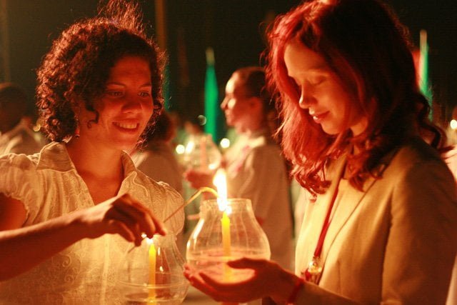 Women holding candles
