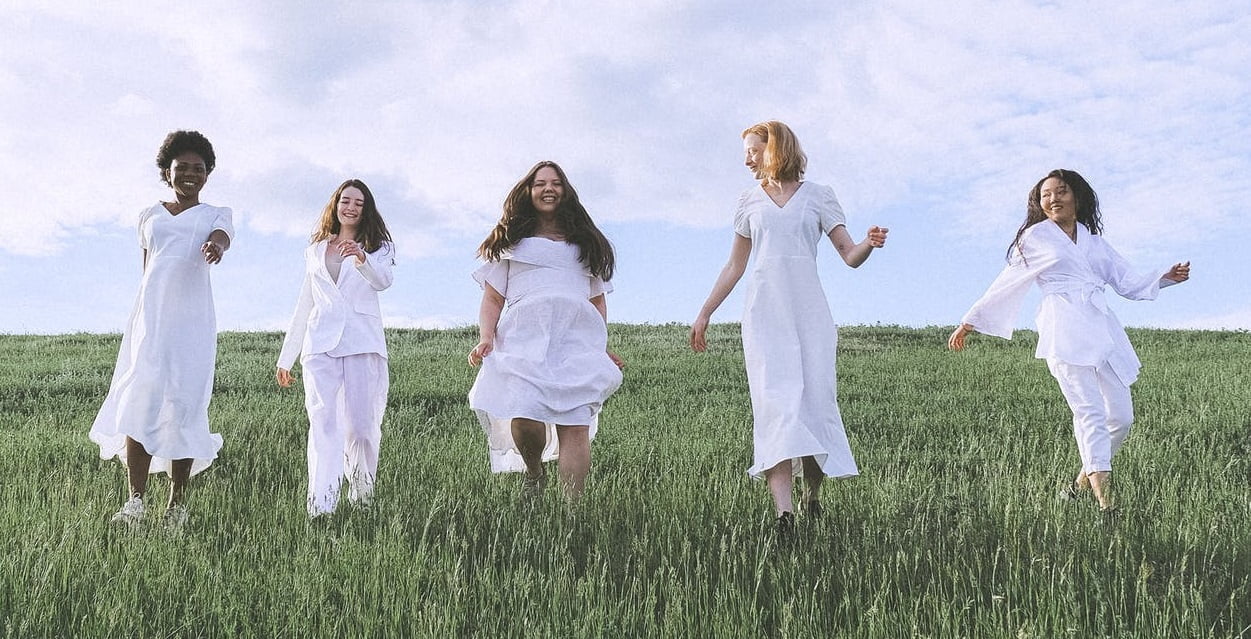 AWE women together in a meadow