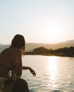 careless but carefree woman by lake