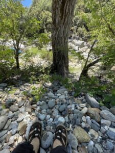 Sitting with my feet showing, at the river crossing
