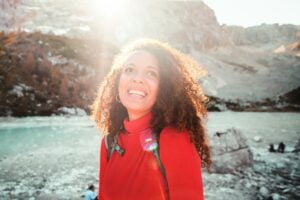smiling woman who experiences grace and non-attachment