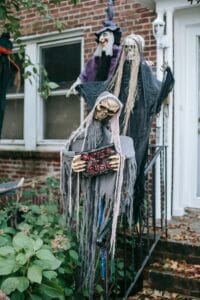 Spooky skeletons hung by a door for halloween