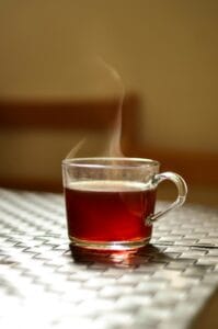 a cup of tea with steam wafting up takes us into timelessness