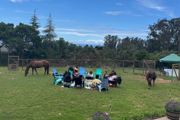 Group with horses at Beyond Liberty Equine Education and Horse Retirement Center